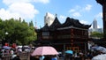 Chenghuangmiao street with travelers and pagoda style buildings