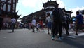 Chenghuangmiao street with travelers and pagoda style buildings