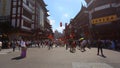 Chenghuangmiao street with travelers and pagoda style buildings