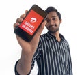 Chennai, India, August 2022 :Selective focus of a young boy holding mobile and displayed on Airtel 5G on a mobile device screen