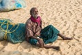 CHENNAI, INDIA - FEBRUARY 10: An unidentified man sits on the sand near the Marina Beach on February 10, 2013 in Chennai