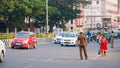 CHENNAI, INDIA - JANUARY 2018 :Traffic police controlling the vehicles on the road. Passengers and commuters in the downtown of Ch