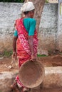 An Indian construction worker woman working at a Building Const