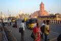 People waiting for bus or tuk tuk taxi on a bas stop in Chennai