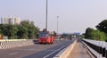 Tamil Nadu government`s red local city bus runs on road