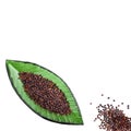 Chenopodium quinoa - Organic quinoa black seeds in leaf shaped container Royalty Free Stock Photo