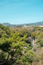 Cheonjiyeon waterfall and green forest park view in Jeju island, Korea