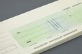 Cheque book and a blank cheque Royalty Free Stock Photo