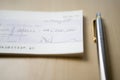 Cheque for one million dollars lying next to pen on table close-up Royalty Free Stock Photo