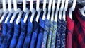 chequered men shirts in different colors on hangers Royalty Free Stock Photo