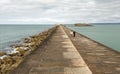 Couples stroll through fortifications dyke in the harbor of Cherbourg. Normandy, France