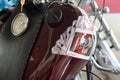 Custom motorcycle fuel tank close up with game cards, speedometer and key