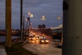 A large automobile bridge on which cars drive at night. Royalty Free Stock Photo