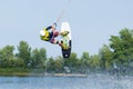 Cherkassy, Ukraine - July 19, 2019: Wakeboarder showing of tricks and skills at wakeboarding event in Cherkassy