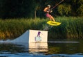 Cherkassy, Ukraine - July 19, 2019: Wakeboarder showing of tricks and skills at wakeboarding event in Cherkassy