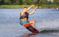 Cherkassy, Ukraine - July 19, 2019: Wakeboarder showing of tricks and skills at wakeboarding event in Cherkassy