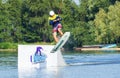 Cherkassy, Ukraine - July 19, 2019: Wakeboarder showing of tricks and skills at wakeboarding event in Cherkassy