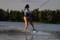 Cherkassy, Ukraine - July 19, 2019: Wakeboarder girl showing of tricks and skills at wakeboarding event in Cherkassy