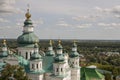 Chernigov, Ukraine. August 15, 2017. Christian orthodox white church with green domes and gold crosses. View from high. Calm sky Royalty Free Stock Photo