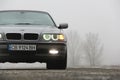 Chernigov, Ukraine - January 6, 2021: Old car BMW 7 Series E38 on the road against a background of fog. Gloomy weather. Bmw and Royalty Free Stock Photo