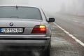 Chernigov, Ukraine - January 6, 2021: Old car BMW 7 Series E38 on the road against a background of fog. Gloomy weather. Bmw and Royalty Free Stock Photo