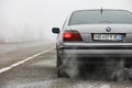 Chernigov, Ukraine - January 6, 2021: Old car BMW 7 Series E38 on the road against a background of fog. Gloomy weather. Bmw and Royalty Free Stock Photo