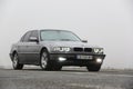Chernigov, Ukraine - January 6, 2021: Old car BMW 7 Series E38 on the road against a background of fog. Gloomy weather. Bmw and