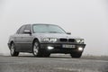 Chernigov, Ukraine - January 6, 2021: Old car BMW 7 Series E38 on the road against a background of fog. Gloomy weather. Bmw and Royalty Free Stock Photo