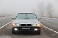 Chernigov, Ukraine - January 6, 2021: Old car BMW 7 Series E38 on the road against a background of fog. Gloomy weather. Bmw and Royalty Free Stock Photo