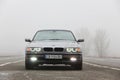 Chernigov, Ukraine - January 6, 2021: Old car BMW 7 Series E38 on the road against a background of fog. Gloomy weather. Bmw and Royalty Free Stock Photo