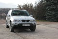 Chernigov, Ukraine - November, 2017.Gray off-road car BMW X5. A private car parked on the sidewalk