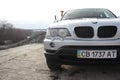 Chernigov, Ukraine - November, 2017.Gray off-road car BMW X5. A private car parked on the sidewalk