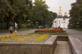 Chernigov, Ukraine. September 15, 2017. Christian orthodox white church with grey domes and gold crosses. Park with flowers. Calm Royalty Free Stock Photo