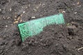 A large computer circuit board buried in the ground Royalty Free Stock Photo