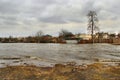 Flooding of river in spring in town during melting of snow. Natural disaster Royalty Free Stock Photo