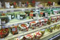 Cakes on the shelves of supermarket. Shop for sweet tooth