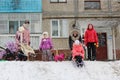 Children are sleding from the hill