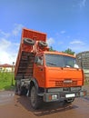 Dump truck KAMAZ is standing with body raised. Truck for transportation