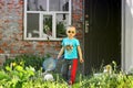 Chernihiv, Ukraine - May 19, 2019: A little boy plays badminton on the street Royalty Free Stock Photo