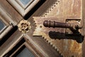 Chernivtsi, Ukraine - August 5, 2021. Antique doorknob on the door in the Church of the Three Saints of the 19th century Royalty Free Stock Photo