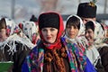 Young hucul woman performs Malanka song during the ethnic festival of Christmas Carols in open-air museum of folk architecture.Wo