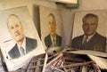 Portraits of politicians against the background of a ruined room in the town of Pripyat