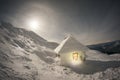 Iced shelter from the rising moon Royalty Free Stock Photo