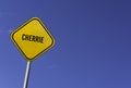 Cherrie - yellow sign with blue sky background