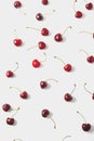 Cherries arranged on a white background