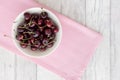 Cherries in a Bowl on Pink and White Wood Royalty Free Stock Photo