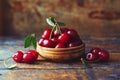 Cherries in a bowl on a wooden table Royalty Free Stock Photo