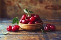 Cherries in a bowl on a wooden table Royalty Free Stock Photo