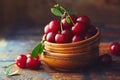 Cherries in a bowl on a wooden table Royalty Free Stock Photo