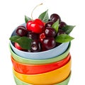 Cherries in colorful cups Royalty Free Stock Photo